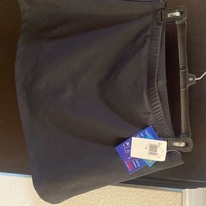 New Marika Black tennis skirt with built-in shorts. Size large,